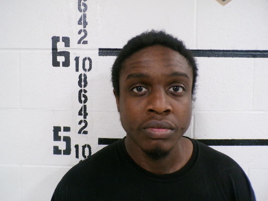 Booking photograph of Deraje Nathaniel Jackson against a height-chart wall.
